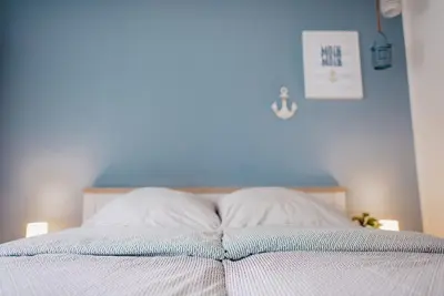 Ein Bett oder Betten in einem Zimmer der Unterkunft Kalle