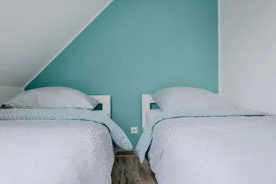 Ein Bett oder Betten in einem Zimmer der Unterkunft Kalle