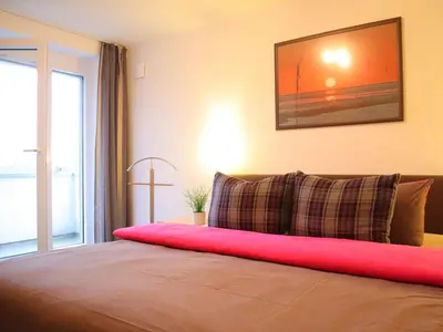 Ein Bett oder Betten in einem Zimmer der Unterkunft Ferienwohnung Sonnenbogen