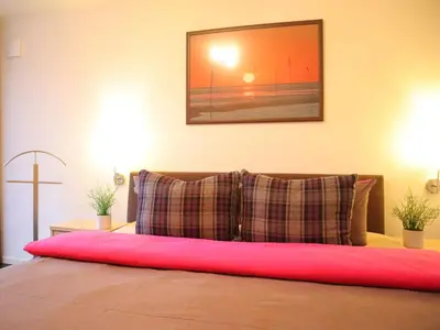 Ein Bett oder Betten in einem Zimmer der Unterkunft Ferienwohnung Sonnenbogen