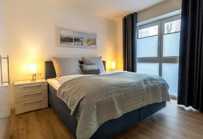 Ein Bett oder Betten in einem Zimmer der Unterkunft Ankerplatz - Dorumer Sielhuus 8