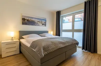 Ein Bett oder Betten in einem Zimmer der Unterkunft Ankerplatz - Dorumer Sielhuus 8