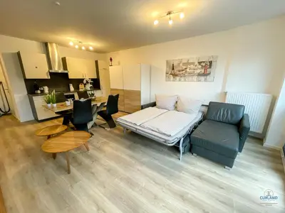 Ein Sitzbereich in der Unterkunft Moderne Ferienwohnung mitten in Duhnen - Ocean Dream Wohnung 2