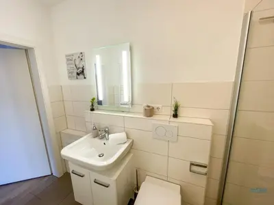 Ein Badezimmer in der Unterkunft Moderne Ferienwohnung mitten in Duhnen - Ocean Dream Wohnung 2