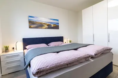 Ein Bett oder Betten in einem Zimmer der Unterkunft Dorumer Sielhuus 13