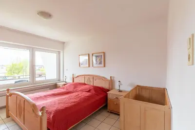 Ein Bett oder Betten in einem Zimmer der Unterkunft Haus Dallacker 5, Whg 8