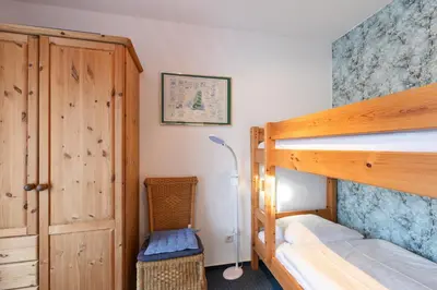 Ein Bett oder Betten in einem Zimmer der Unterkunft Haus Elbe 1, Whg 11