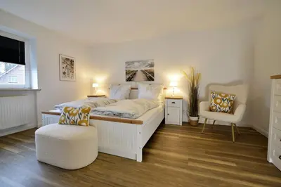 Ein Bett oder Betten in einem Zimmer der Unterkunft Haus Eschenhof EH02