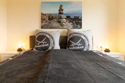 Ein Bett oder Betten in einem Zimmer der Unterkunft Dorumer Sielhuus 12