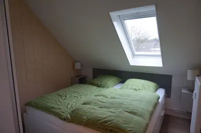 Ein Bett oder Betten in einem Zimmer der Unterkunft Vinnenhus Wohnung 06