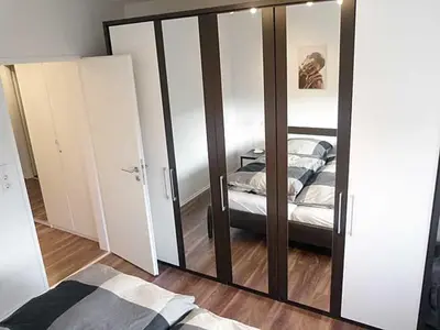 Ein Bett oder Betten in einem Zimmer der Unterkunft strandnahe TRAUMWOHNUNGEN 1 2