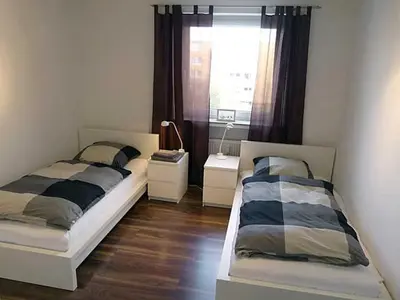 Ein Bett oder Betten in einem Zimmer der Unterkunft strandnahe TRAUMWOHNUNGEN 1 2