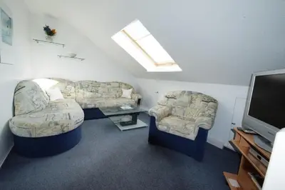 Ein Sitzbereich in der Unterkunft Ferienhaus Helder