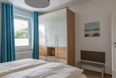 Ein Bett oder Betten in einem Zimmer der Unterkunft Apartments Christiansen