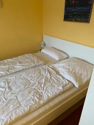 Ein Bett oder Betten in einem Zimmer der Unterkunft Elbschiffer