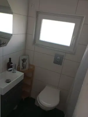 Ein Badezimmer in der Unterkunft GlücksGezeiten