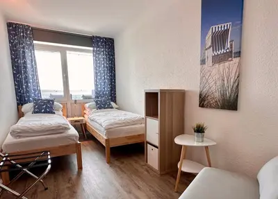 Ein Bett oder Betten in einem Zimmer der Unterkunft Frische Brise FeWo 15 03