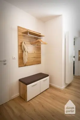 Ein Bett oder Betten in einem Zimmer der Unterkunft Dünenquartier Cuxhaven