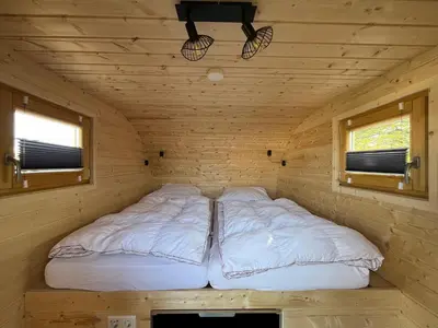 Ein Bett oder Betten in einem Zimmer der Unterkunft Strandgut Kajüte