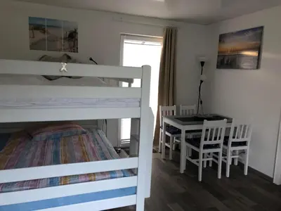 Ein Bett oder Betten in einem Zimmer der Unterkunft FEWO Priel Watt Nr.2