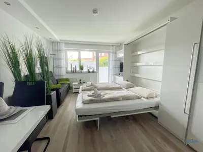 Ein Bett oder Betten in einem Zimmer der Unterkunft Strandappartement 7 - Modernes Appartement in Strandnähe