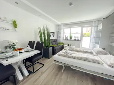 Ein Bett oder Betten in einem Zimmer der Unterkunft Strandappartement 7 - Modernes Appartement in Strandnähe