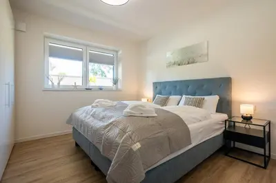 Ein Bett oder Betten in einem Zimmer der Unterkunft Dorumer Seestern - Dorumer Sielhuus 3