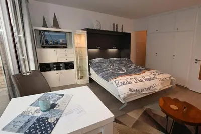 Ein Bett oder Betten in einem Zimmer der Unterkunft Watt n Meer
