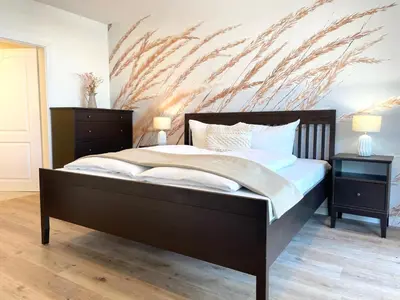 Ein Bett oder Betten in einem Zimmer der Unterkunft Haus Nordseebrandung FeWo 9