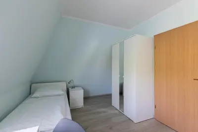 Ein Bett oder Betten in einem Zimmer der Unterkunft Haus Luv und Lee Wohnung 26