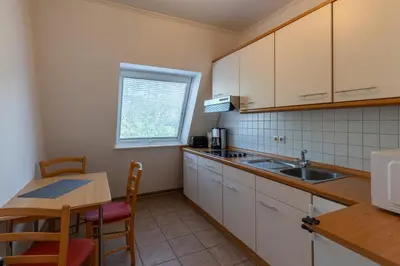 Küche/Küchenzeile in der Unterkunft Haus Luv und Lee Wohnung 26