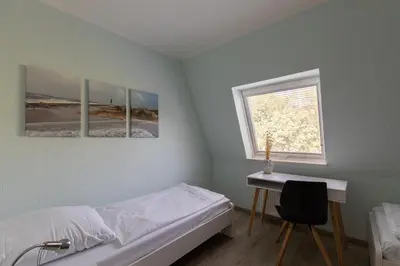 Ein Bett oder Betten in einem Zimmer der Unterkunft Haus Luv und Lee Wohnung 26