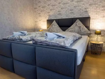 Ein Bett oder Betten in einem Zimmer der Unterkunft Haus Sonneneck 1