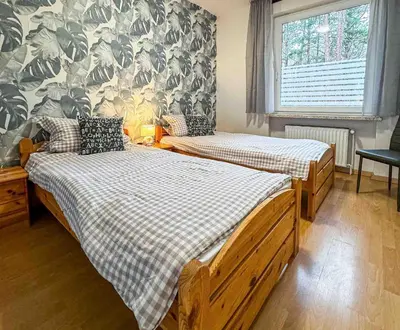 Ein Bett oder Betten in einem Zimmer der Unterkunft Haus Sonneneck 2
