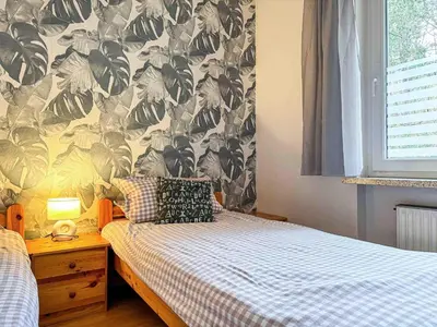 Ein Bett oder Betten in einem Zimmer der Unterkunft Haus Sonneneck 2