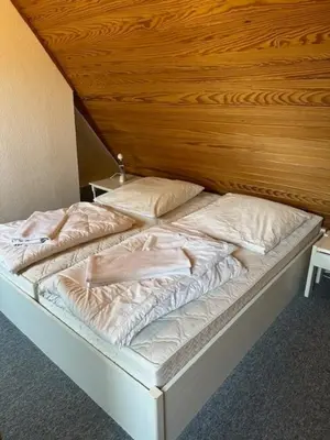 Ein Bett oder Betten in einem Zimmer der Unterkunft Kampweg 1 Wohnung 1