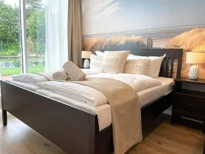 Ein Bett oder Betten in einem Zimmer der Unterkunft Haus Nordseebrandung FeWo 8