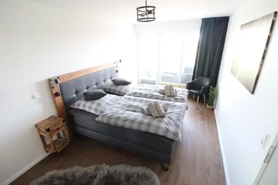Ein Bett oder Betten in einem Zimmer der Unterkunft Haus Nordseebrandung Wohnung B64