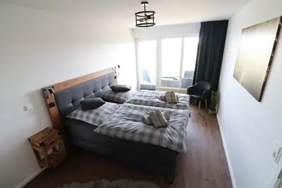 Ein Bett oder Betten in einem Zimmer der Unterkunft Haus Nordseebrandung Wohnung B64
