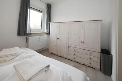 Ein Bett oder Betten in einem Zimmer der Unterkunft Nordseestube