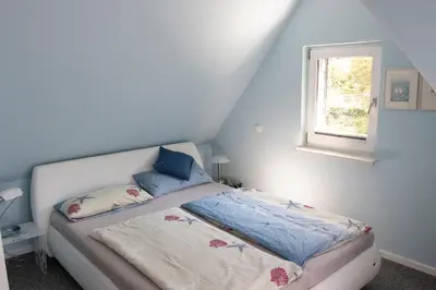 Ein Bett oder Betten in einem Zimmer der Unterkunft Seeluft