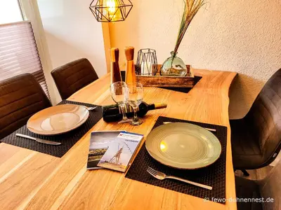 Ein Sitzbereich in der Unterkunft Ferienwohnung Duhnennest in Cuxhaven Duhnen