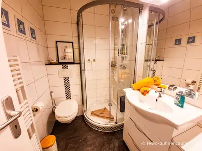 Ein Badezimmer in der Unterkunft Ferienwohnung Duhnenzauber in Cuxhaven Duhnen