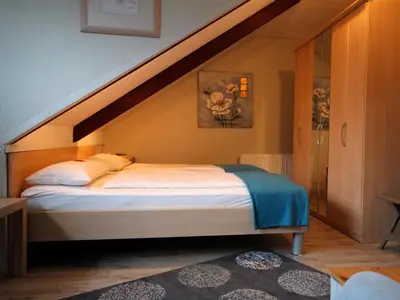 Ein Bett oder Betten in einem Zimmer der Unterkunft Residenz kleine Krabbe