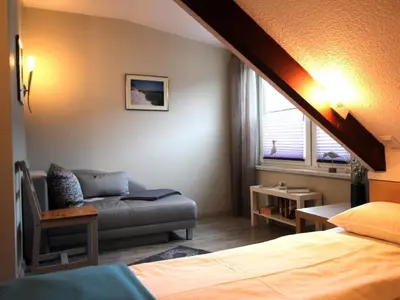 Ein Bett oder Betten in einem Zimmer der Unterkunft Residenz kleine Krabbe