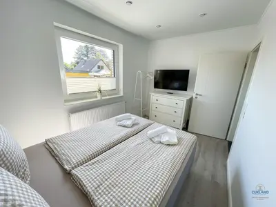 Ein Bett oder Betten in einem Zimmer der Unterkunft Ferienhaus Lindenweg Bad Bederkesa