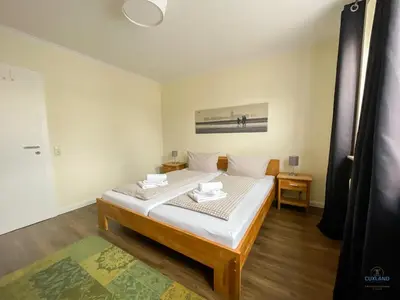 Ein Bett oder Betten in einem Zimmer der Unterkunft Landhaus Rosenhof Wohnung 1