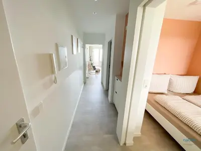Ein Bett oder Betten in einem Zimmer der Unterkunft Kugelbakeblick 51