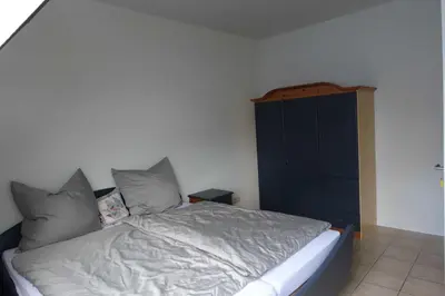Ein Bett oder Betten in einem Zimmer der Unterkunft Urlaub auf dem Janssenhof