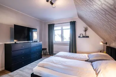 Ein Bett oder Betten in einem Zimmer der Unterkunft Bielshövensand 15 Retro